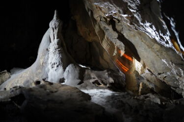 Light reflections along a narrow passage in Herrmann’s Cave